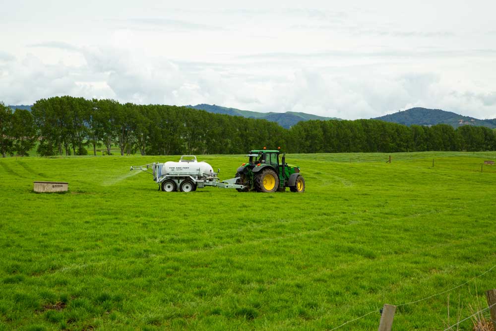 Cold Image used to convey the benefits of nitrogen and sulphur including a John Deere Tractor Towing a Tow and Fert Sprayer